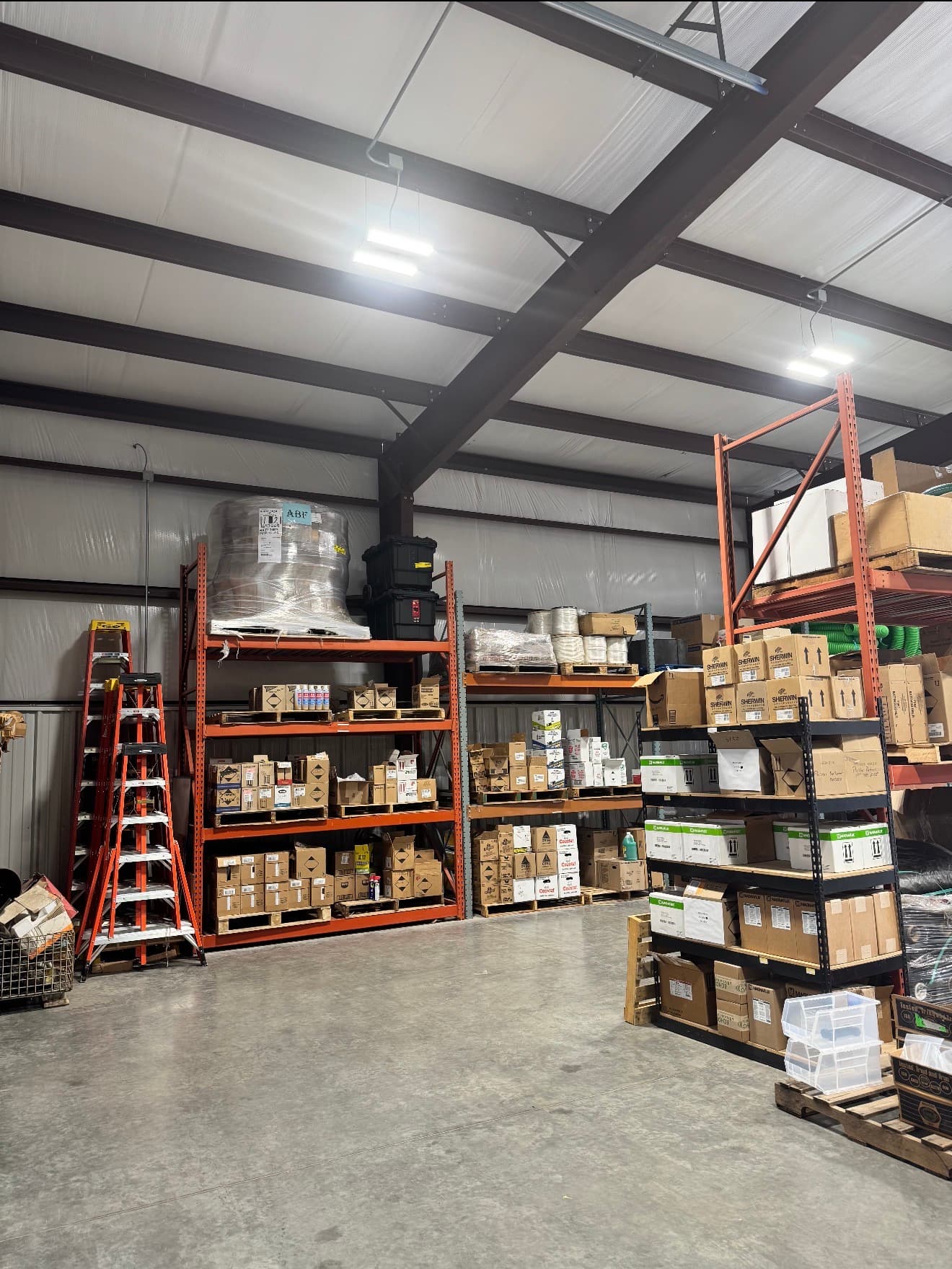Warehouse shelving with stocked industrial supplies